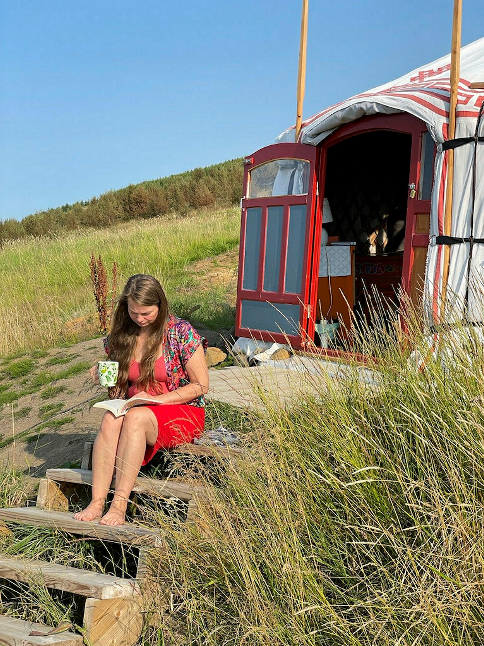 Þóra Sólveig in front of the yurt in Eyjafjörður.