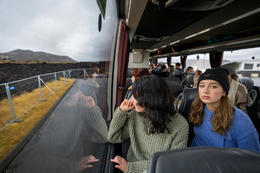 English students looking at the lava that characterizes the landscape around Grindavík.