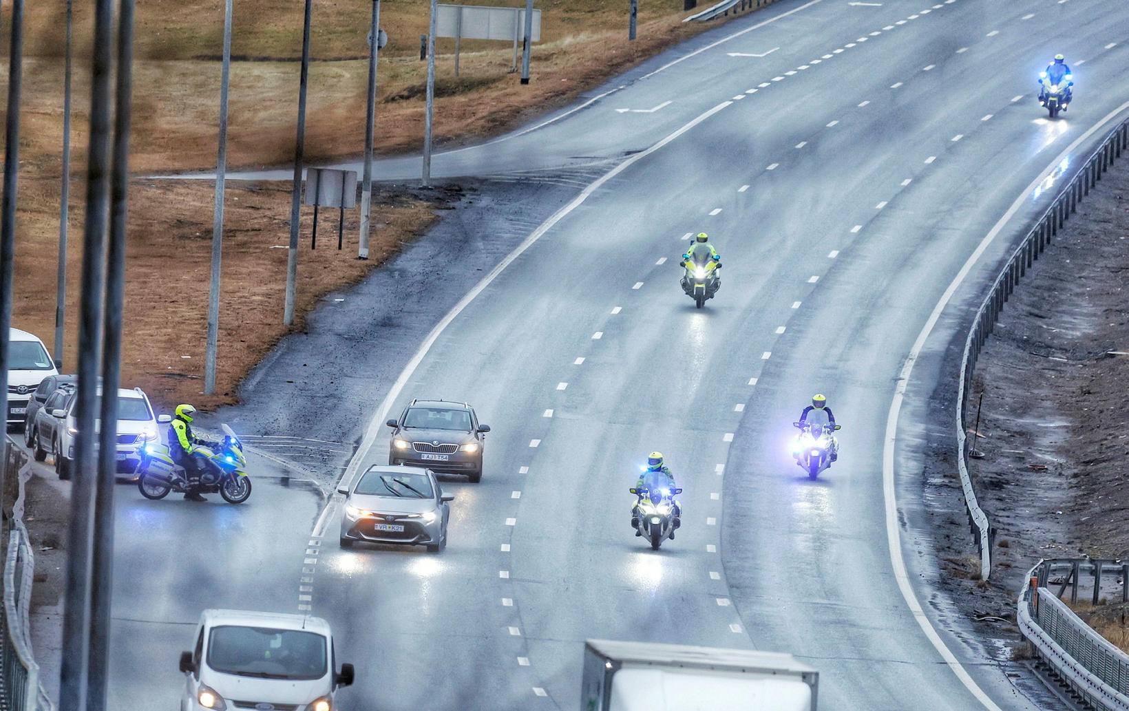 Several police officers on motorcycles followed the convoy and blocked …
