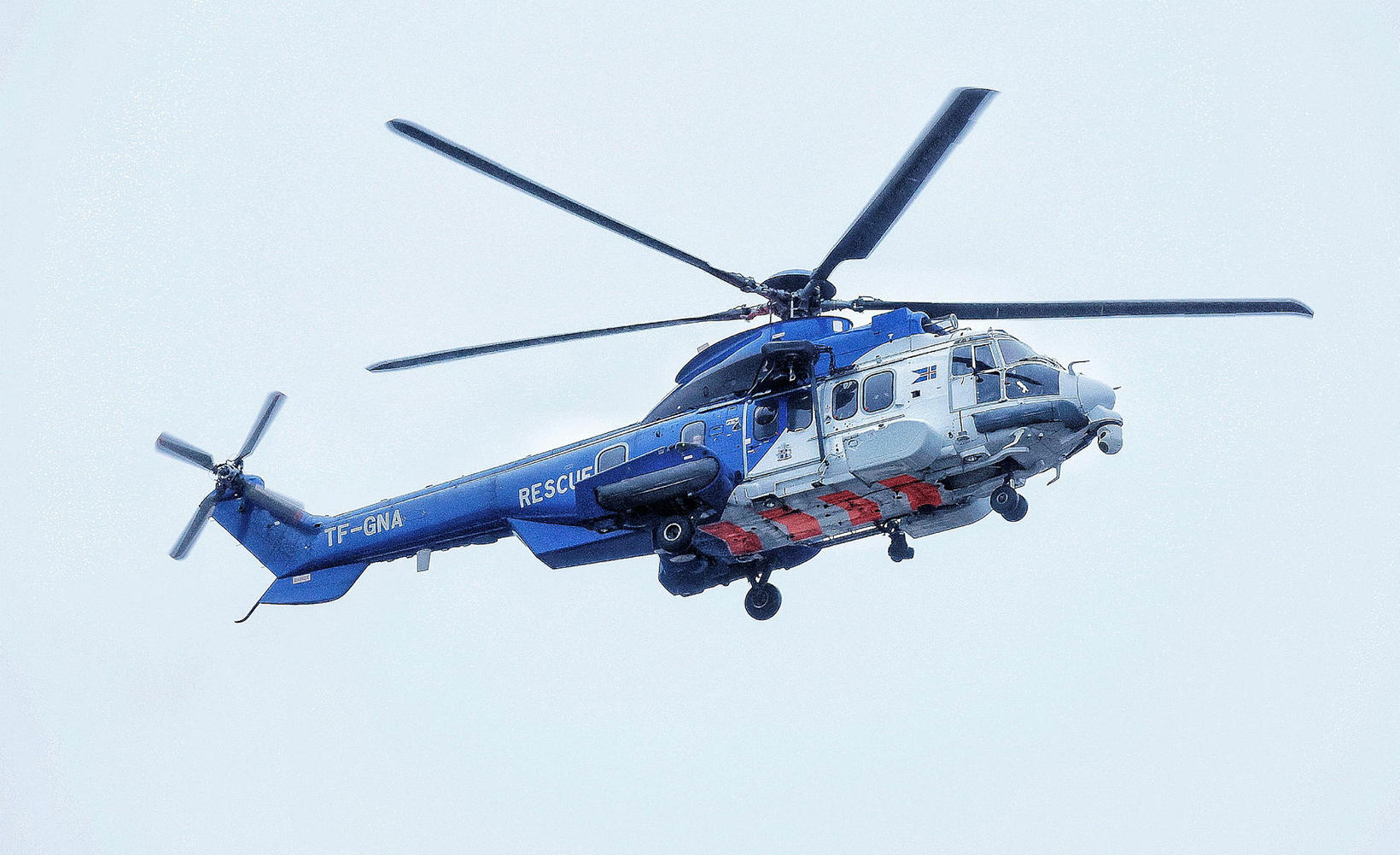 The Coast Guard's helicopter flew with the convoy, just like …
