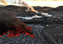 The lava is right next to the car park and will probably flow over it soon.