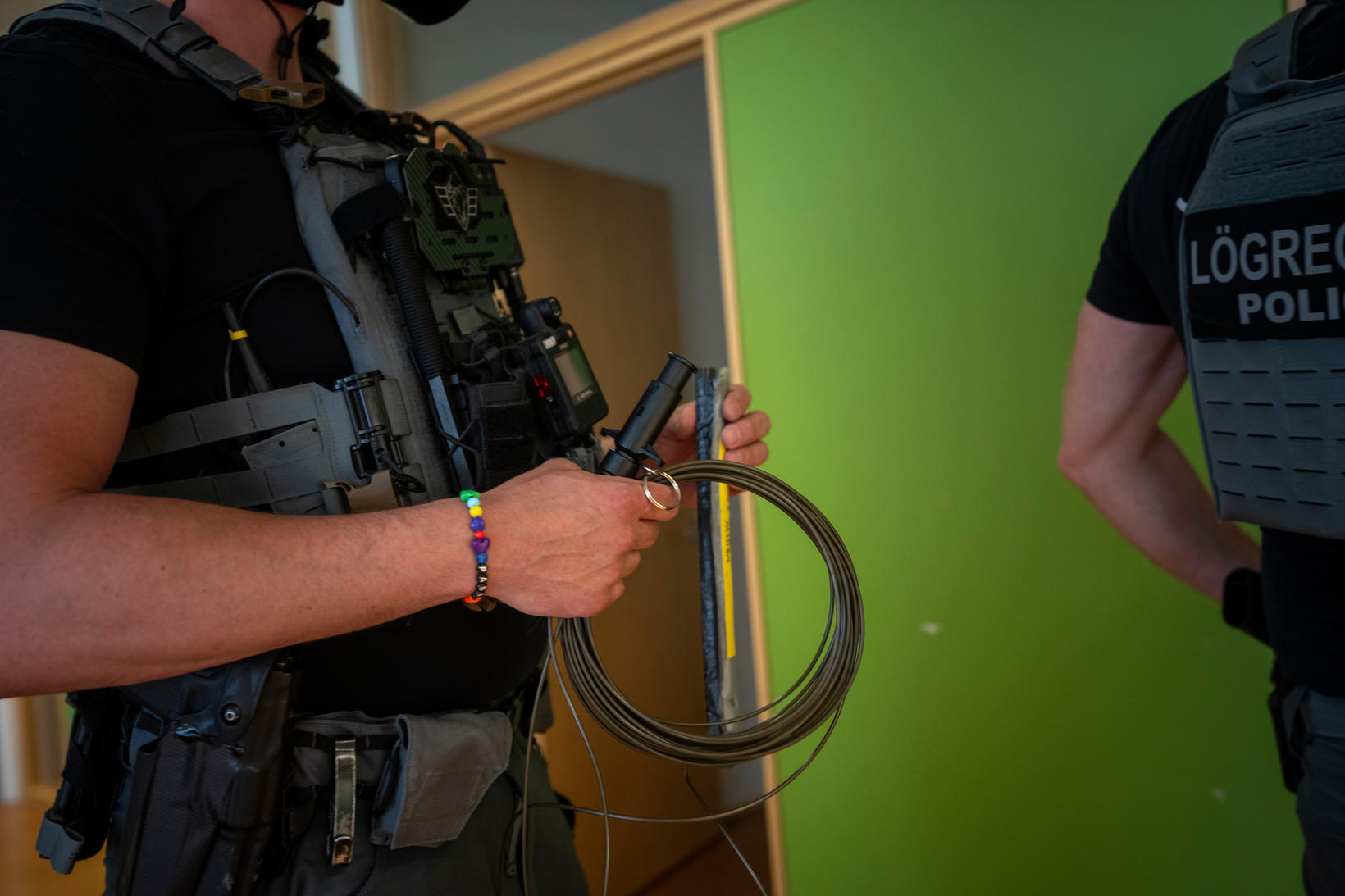 Specialist in preparing bombing exercises with fine bracelet.