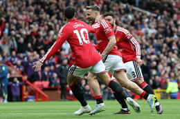 Luke Shaw kom heimamönnum yfir á sjöttu mínútu. [Credit: AFP]