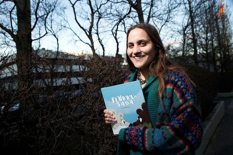 Author Lára Garðarsdóttir with her book, titled Bear with me in English, about a couple of polar bears forced to flee their home.