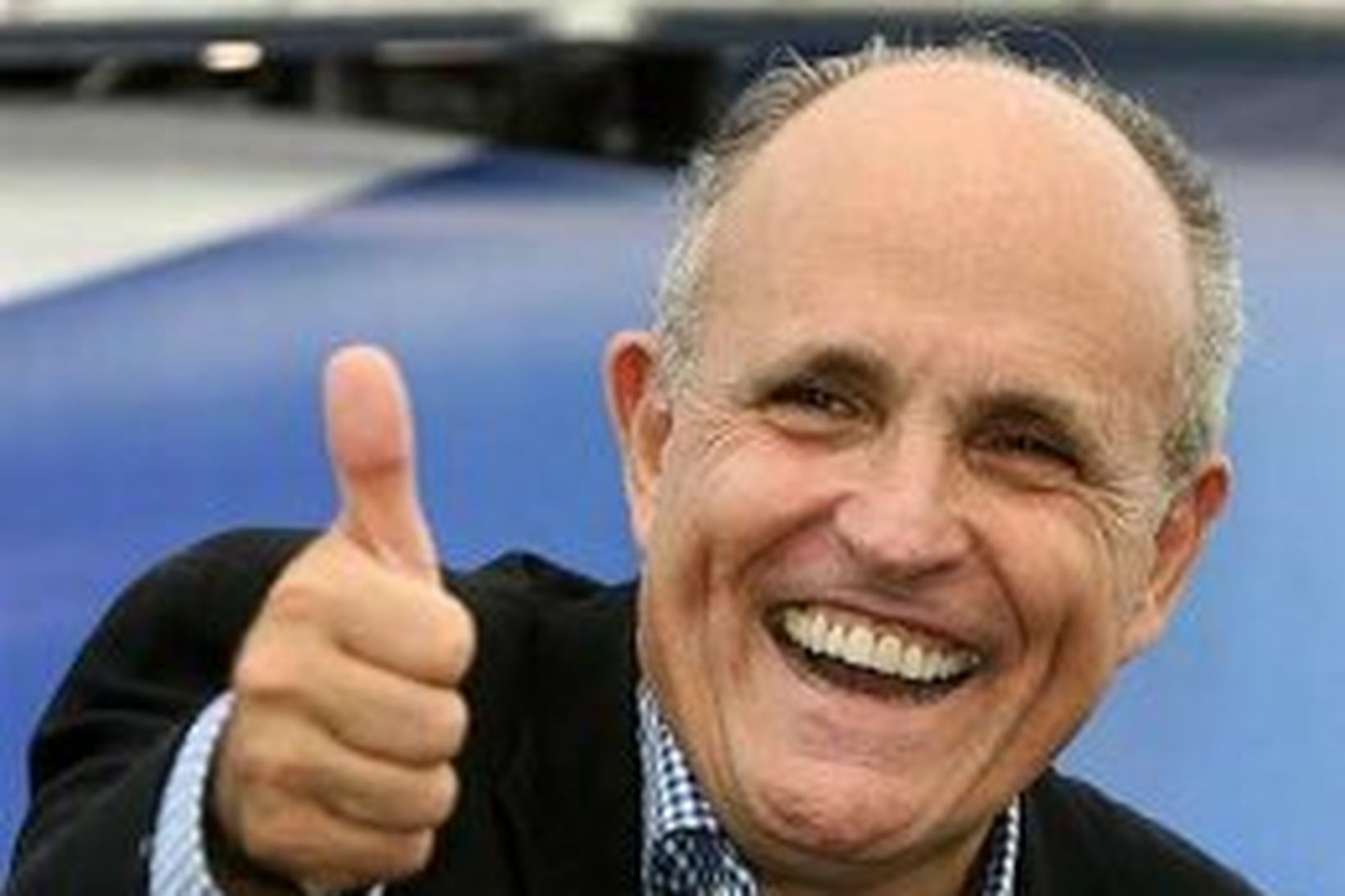 Rudy Giuliani,fyrrverandi borgarstjóri New York, er glaður á svip en …