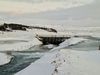 The irrigation canal and the floodgate. The Hvítá River in the distance and in the distance you can see a summer house, a forest and Mt Hestfjall in Grímsnes. Water from the river's channel now flows over land and then cascades from flat surfaces down into the canal, which is full of ice.