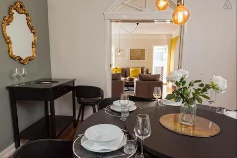 The dining room has original features and trendy grey walls.