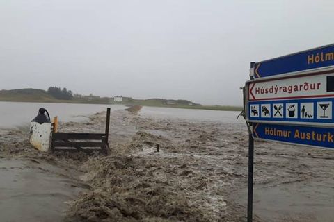 Hólmsá has flooded across the road which now acts like a dam. The farm is completely cut off from all roads now .