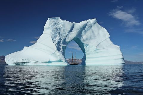 Scooner the Opal can be seen here in the middle of the astonishing iceberg.