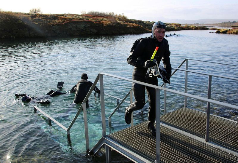 Divers in Silfra fissure.