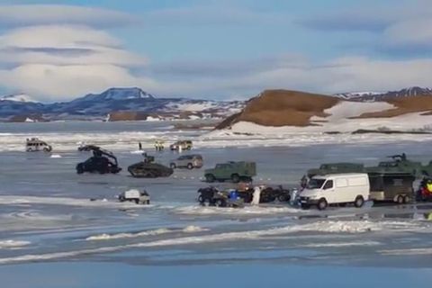 Tanks and army vehicles zooming around on the frozen lake.