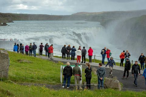 Tourists by Gullfoss waterfall.