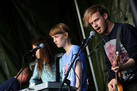 Júlía on stage with her band, Oyama.