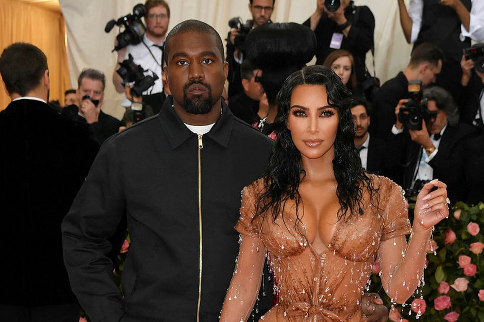Kim Kardashian and Kanye West á Met Gala á mánudaginn. …