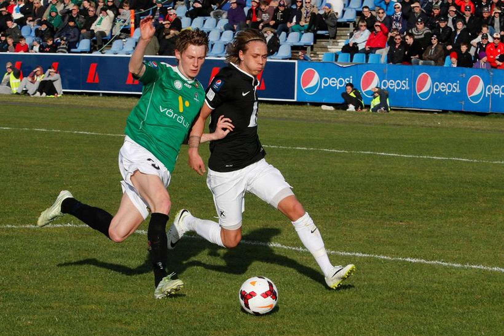 Guðmundur Friðriksson, til vinstri, í leik með Breiðabliki gegn Keflavík.