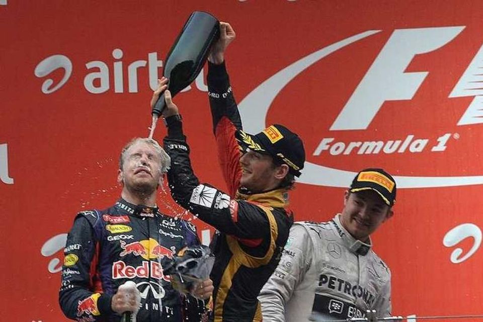 Grosjean hyllir Vettel með því að sturta upp í hann franskri guðaveig.