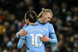 Jack Grealish og Erling Haaland í leik með Manchester City.