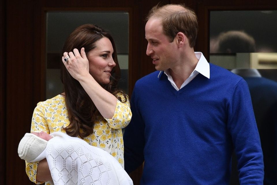 TOPSHOTS Britain's Prince William, Duke of Cambridge (R), looks towards his wife Catherine, Duchess of …