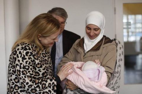 Eygló Harðardóttir welcomes a Syrian mother and baby.