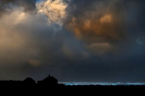 Clouds paint the sky just before a storm hits the seaside town of Hafnir in Reykjanes.
