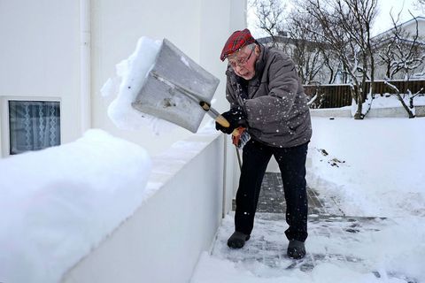 Trausti Magnússon, shoveling snow in his driveway. The picture was taken when he was 97.