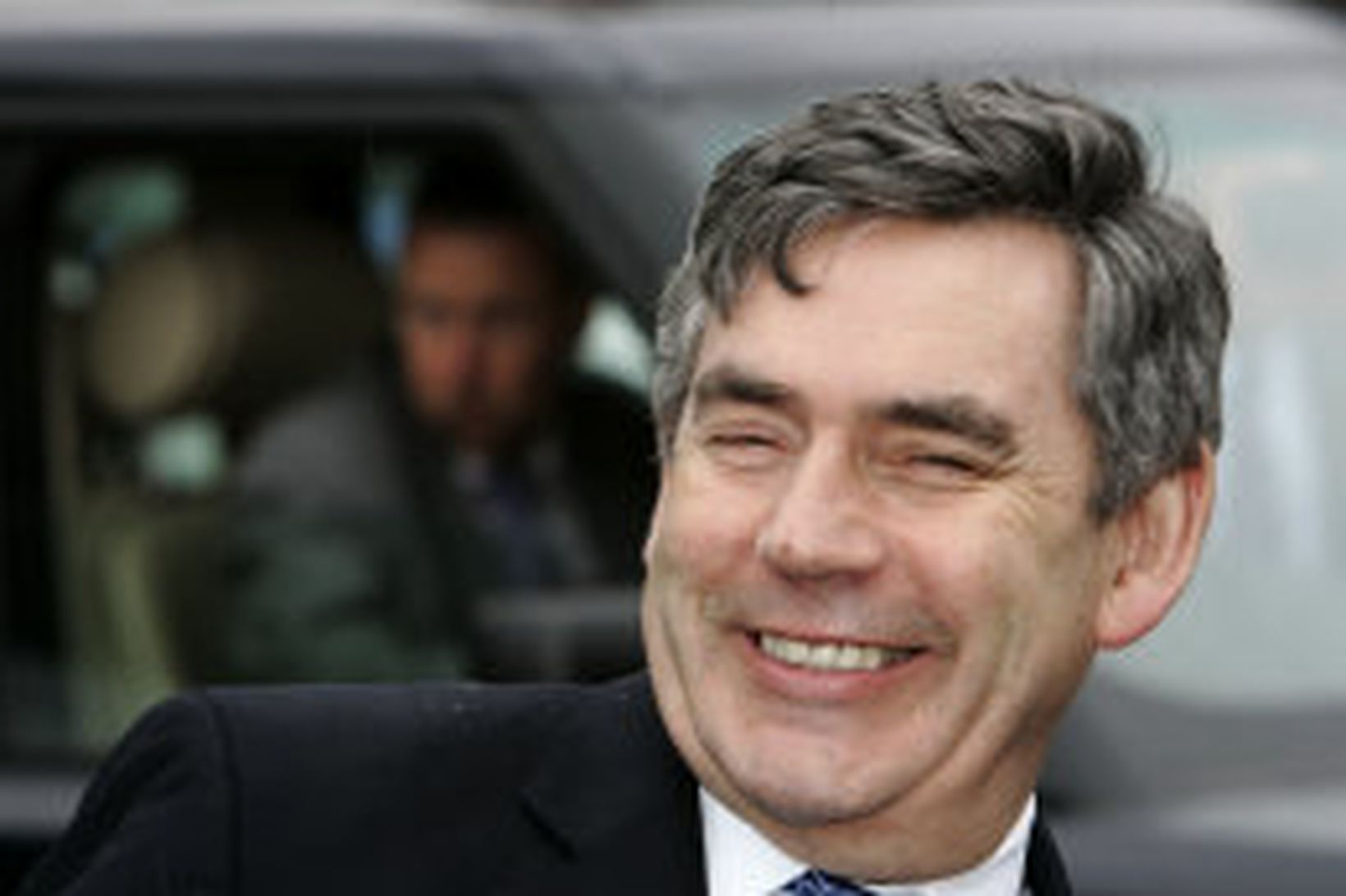 Gordon Brown, forsætisráðherra Breta, brosir sínu blíðasta.