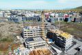 Hamranes Nýbyggingar reistar og allt að gerast. Fjær sést Skarðshlíðin. Hraði framkvæmda fylgir stöðu efnahagsmála, segir bæjarstjórinn.