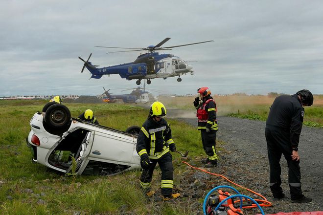 Emergency response exercise involving Coast Guard helicopters.