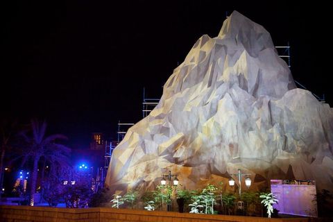 On the front facing side of the mountain is a printed image of a mountain which is deceiving, as at a distance it looks like its three dimensional when its actually a flat printed surface.