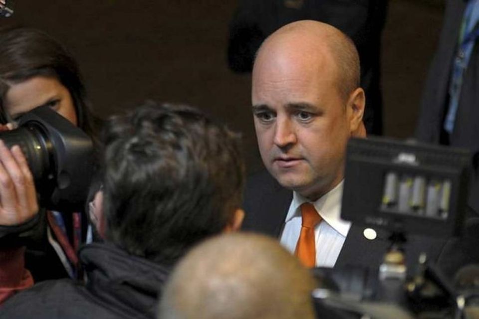 Sweden's Prime Minister Fredrik Reinfeldt (R) arrives at an European Union summit in Brussels December …