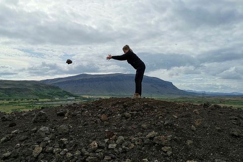 Helena, a park ranger in Þjórsárdalur, throwing away the last of 3,219 rocks from a "wart" near Hjálparfoss waterfall.