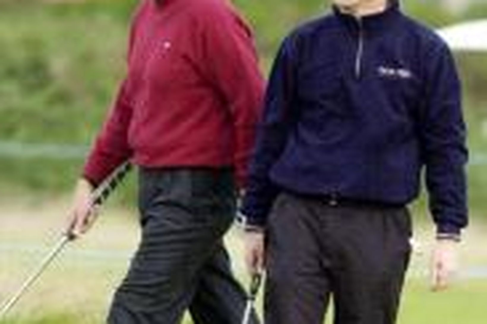 Leikarinn Hugh Grant, (t.h.) og skoski kylfingurinn Colin Montgomerie á …