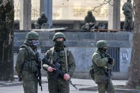 Armed men in front of the Crimean Parliament in March 2014.