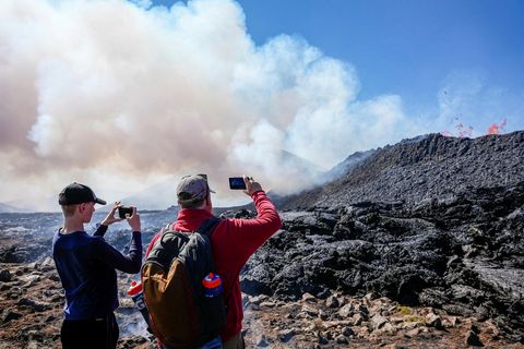 Tourists taking pictures of the eruption at Litli-Hrútur.