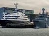 The luxury yacht Octopus is docked at Faxagarður harbor and is seen here with Harpa Concert hall in the background.