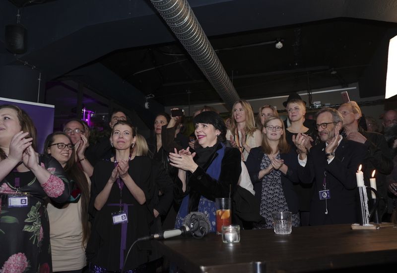 Members of the Pirate Party cheer as vote results are announced.