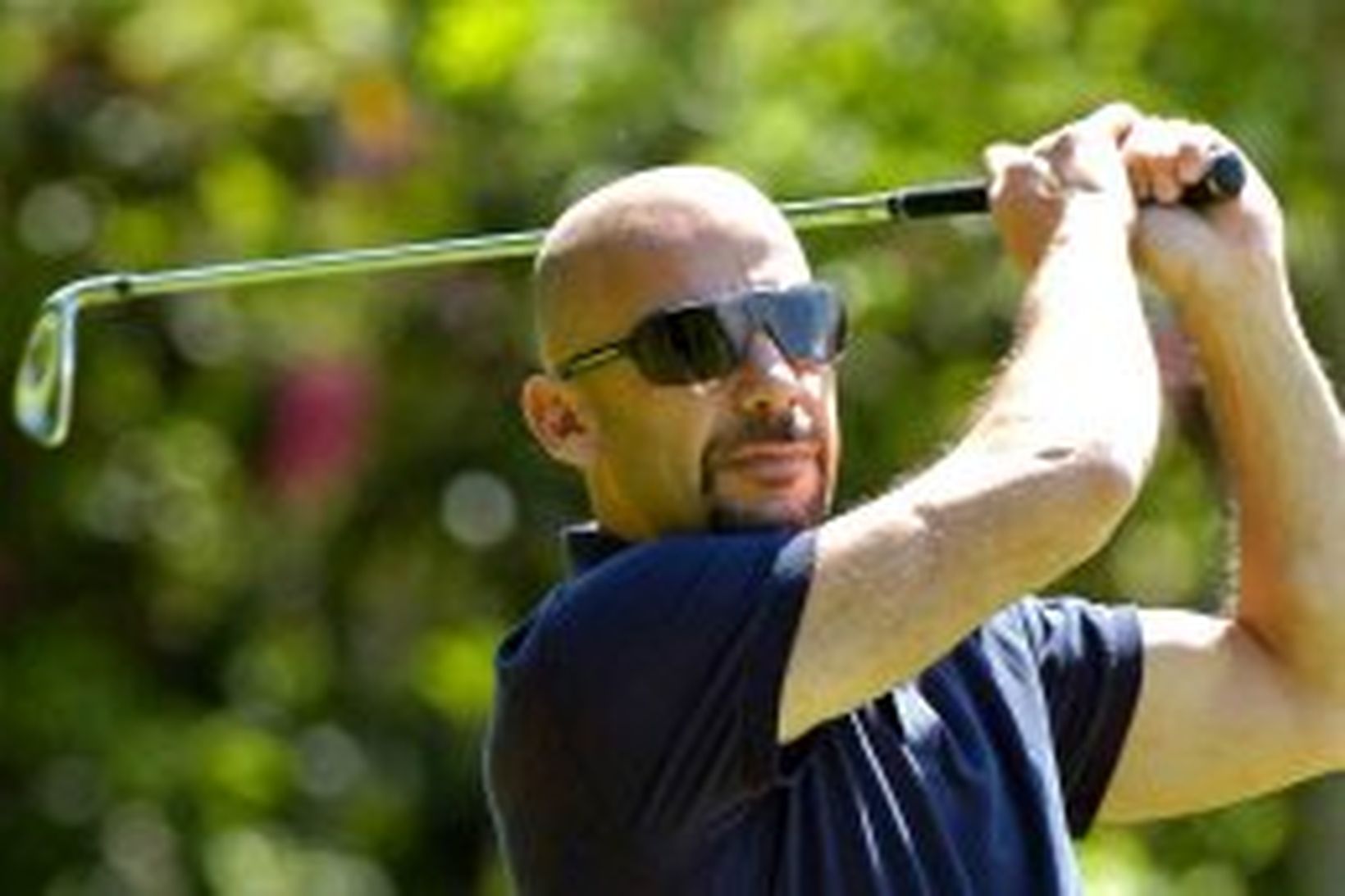 Gianluca Vialli mundar hér golfkylfuna.