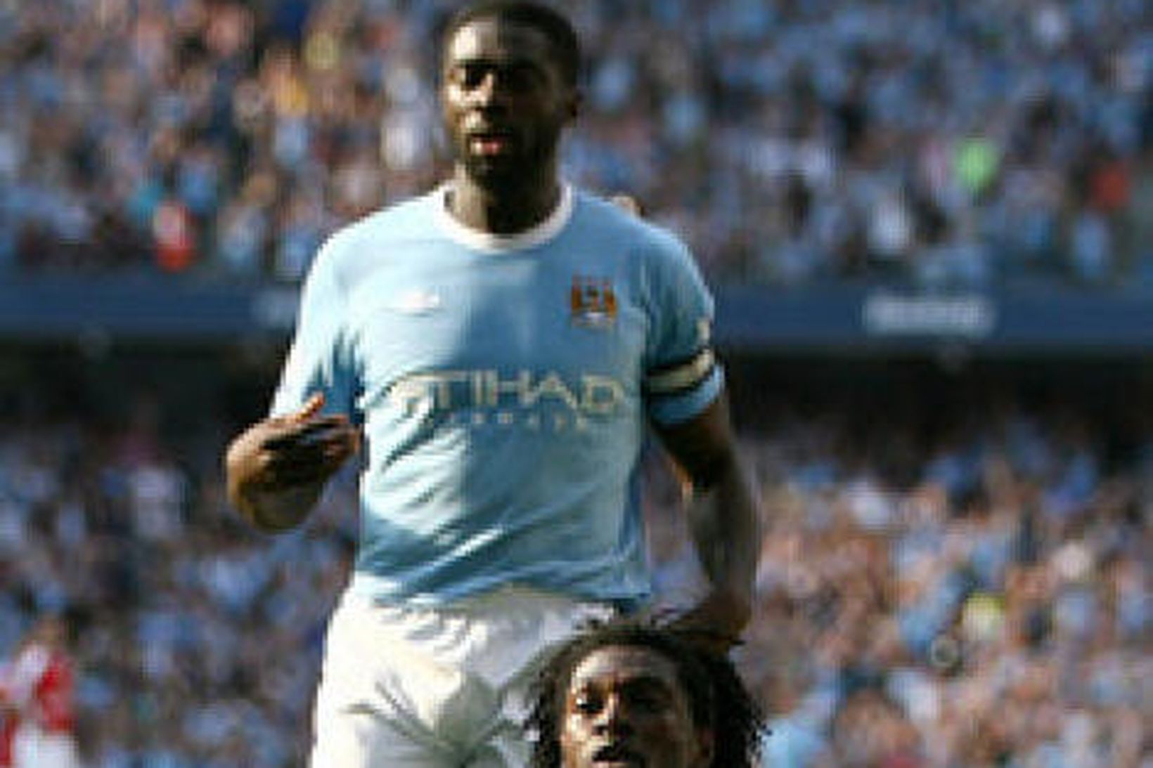 Emmanuel Adebayor fagnar marki sínu gegn Arsenal.