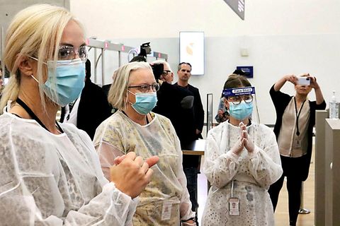 Healthcare workers, ready to test arriving passengers for the coronavirus at Keflavík International Airport.