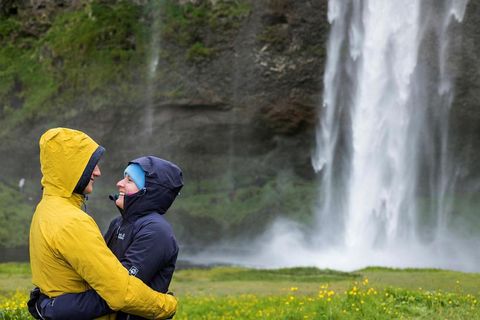 Tourists at Seljalandsfoss waterfall.