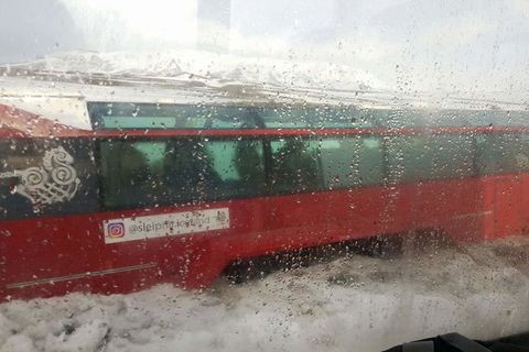 The glacier bus stuck in ice.