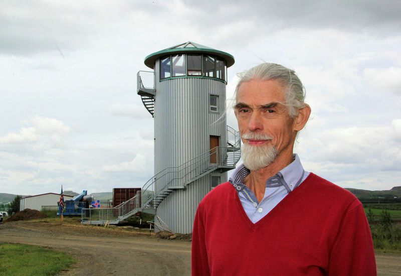 Ásgeir Eiríksson next to the silage tower which was built in 1957.
