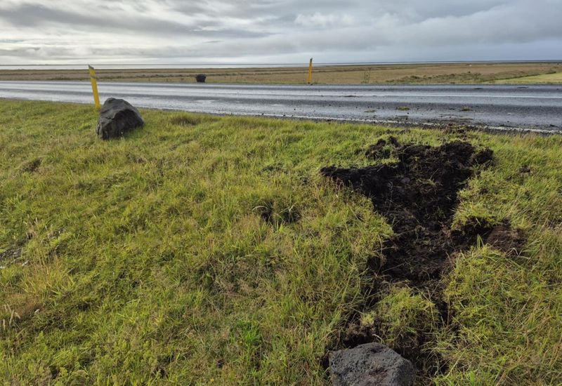 Boulders landed on the road and also crossed over it.