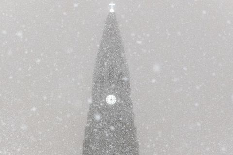Hallgrímskirkja church, one of the city's landmarks, dusted with snowflakes.
