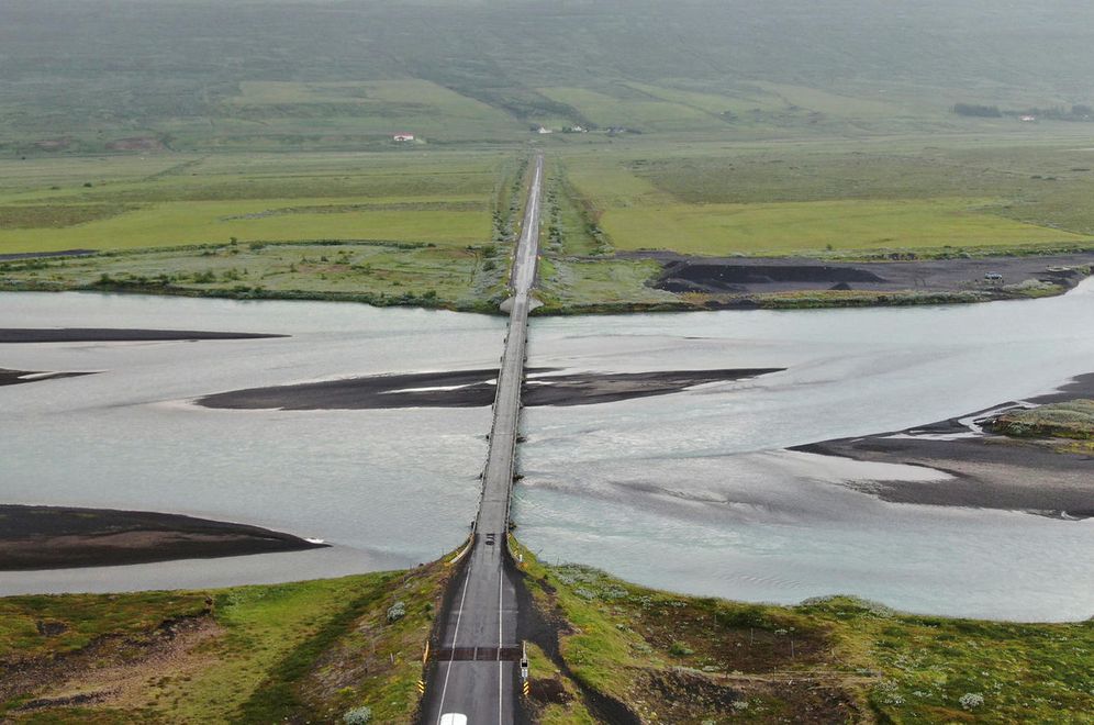 Only passenger cars are allowed to drive over the bridge over Skjálfandafljót river, and trucks …