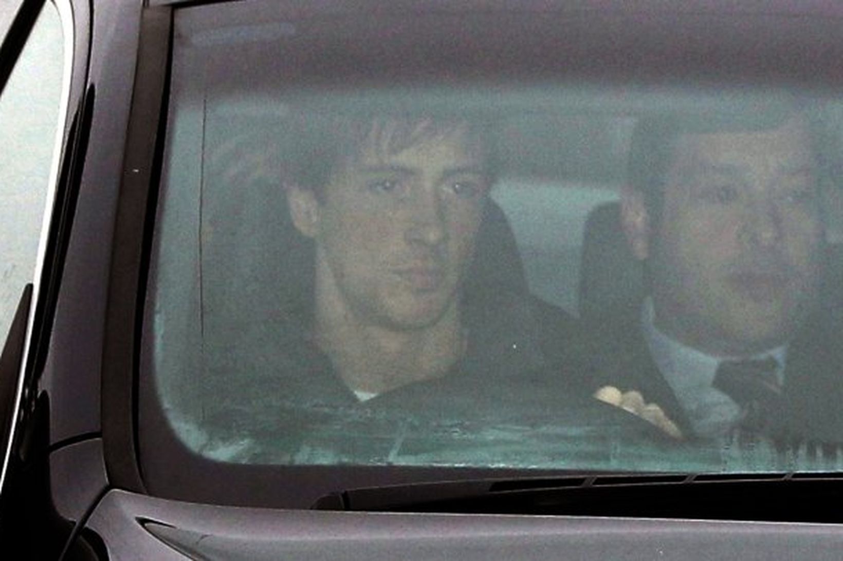 Fernando Torres ekur burt frá Melwood, æfingasvæði Liverpool, í dag.