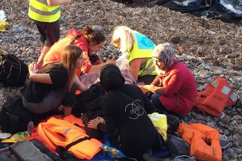 Díana Karlsdóttir on the left, helped a Syrian woman to deliver a baby boy on the island of Lesbos, Greece, yesterday.