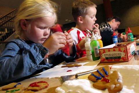 Children decorating piparkökur, or ginger biscuits.