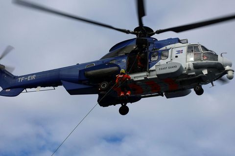 The Coast Guard helicopter was called out to search for the missing people.