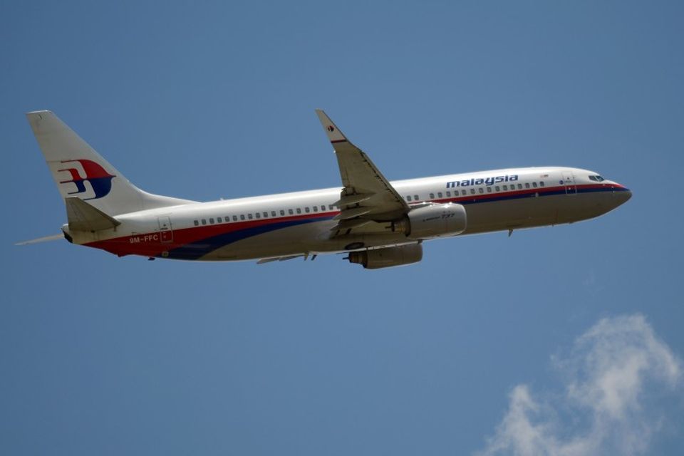 Vél frá Malaysia Airlines á flugi.